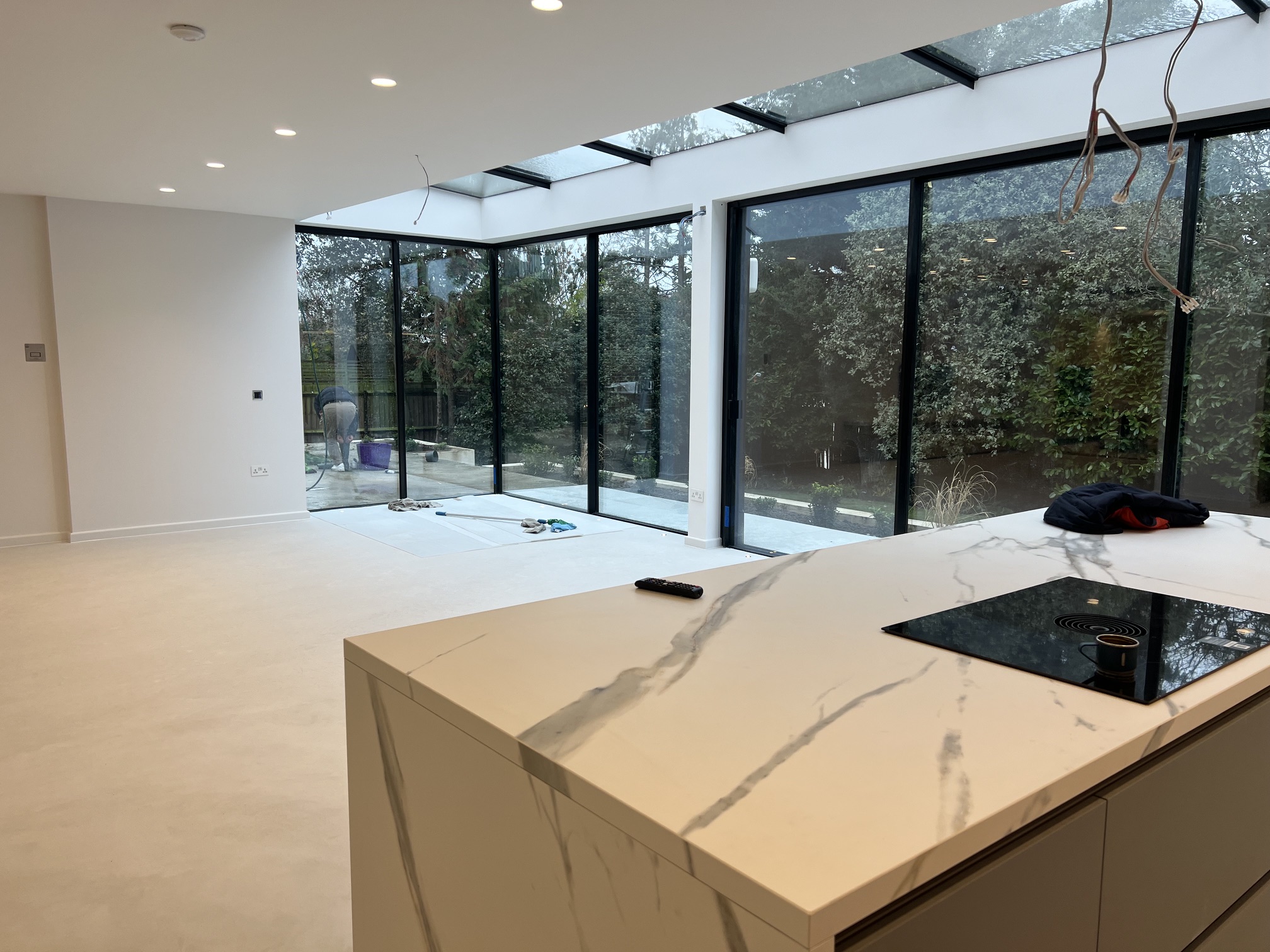 Completed open-plan kitchen refurbishment with glass extension by MM Contractors London