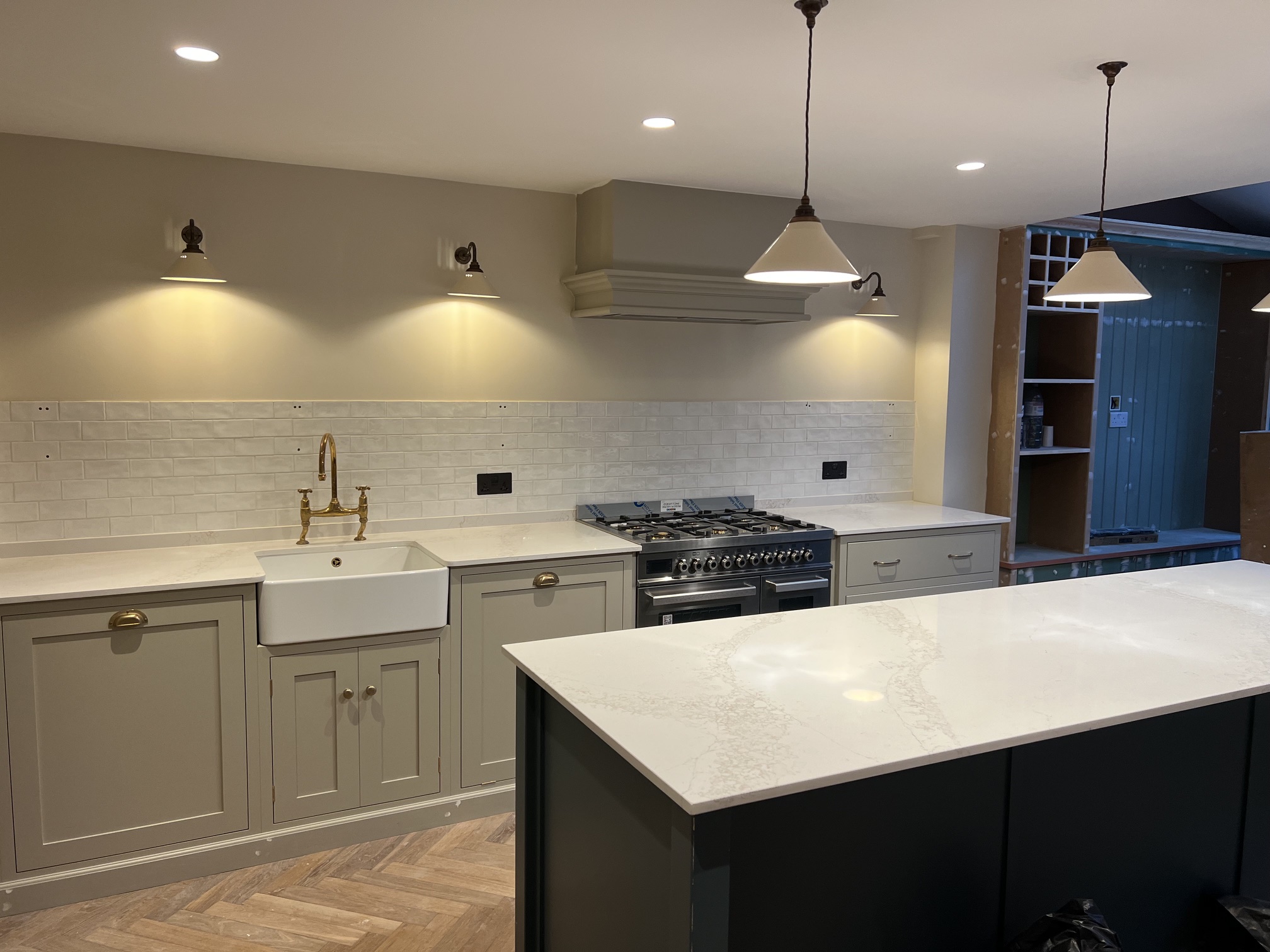 Finished shaker kitchen with Belfast sink and brass fittings — MM Contractors London