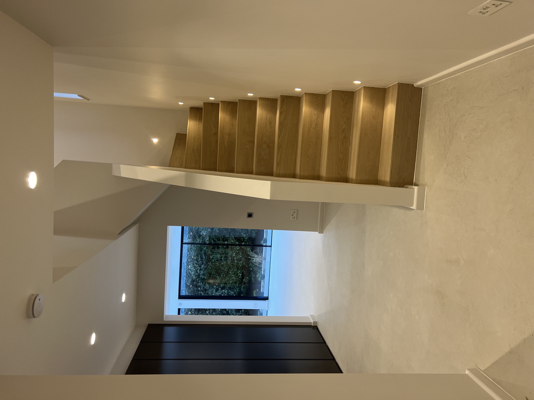 MM Contractors London — completed hallway refurbishment with oak staircase